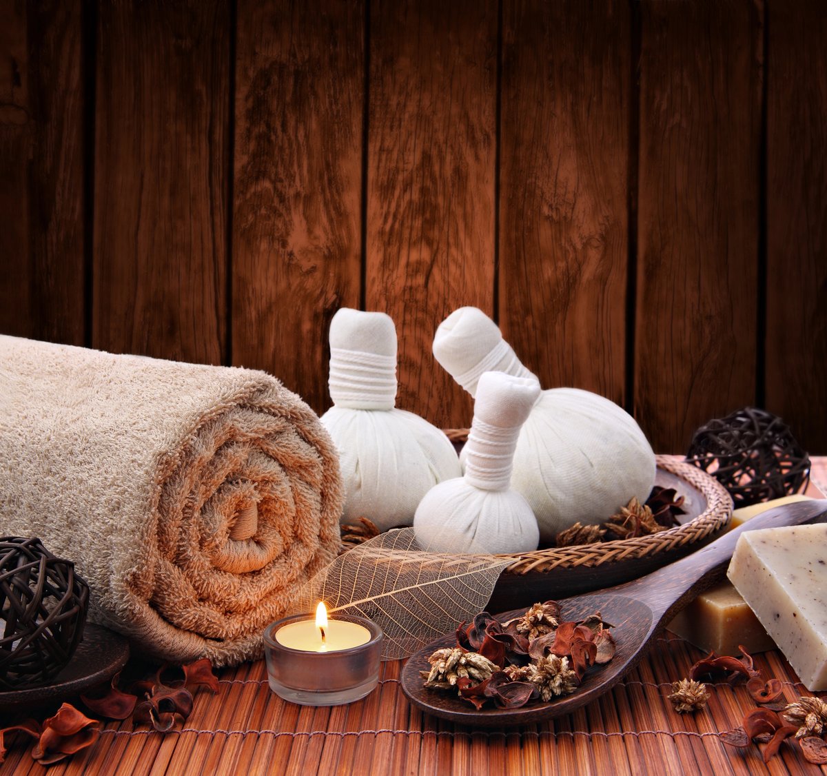 Traditional spa supplies with herbal compress balls and aromatherapy